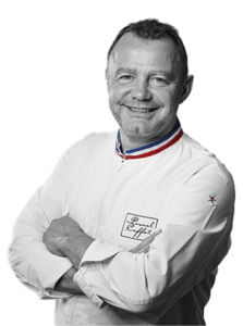 Chef in white uniform, black and white photo.